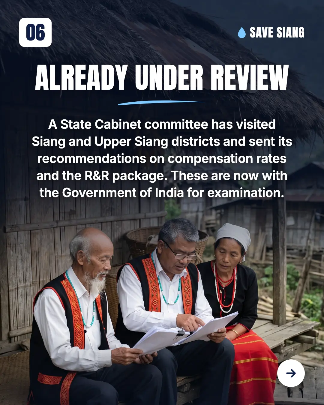 Three Adi elders sit together on the weathered wooden verandah of an old thatched house, reading through a printed report and talking calmly: two men in white shirts and black Adi jackets with woven red borders (one with a long white beard, one with glasses) and a woman in a white head cloth, black blouse and red skirt; old village houses and hills behind. Text: "Already under review. A State Cabinet committee has visited Siang and Upper Siang districts and sent its recommendations on compensation rates and the R&R package. These are now with the Government of India for examination."